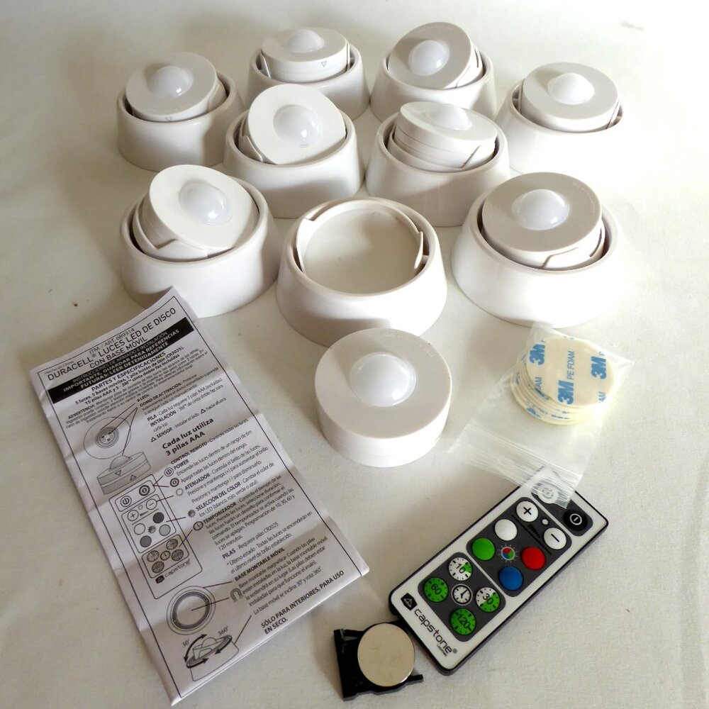 USED ONCE DURACELL COLORED LED PUCK LIGHT SET WITH REMOTE CONTROL & BASES